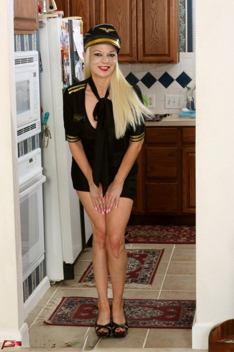 Sexy MILF MaryAnne Moore does a tempting striptease in fetish wear
