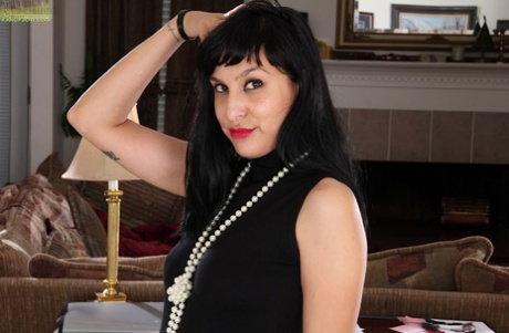 Dark haired milf Penelope Patterson is demonstrating her hairy cunt