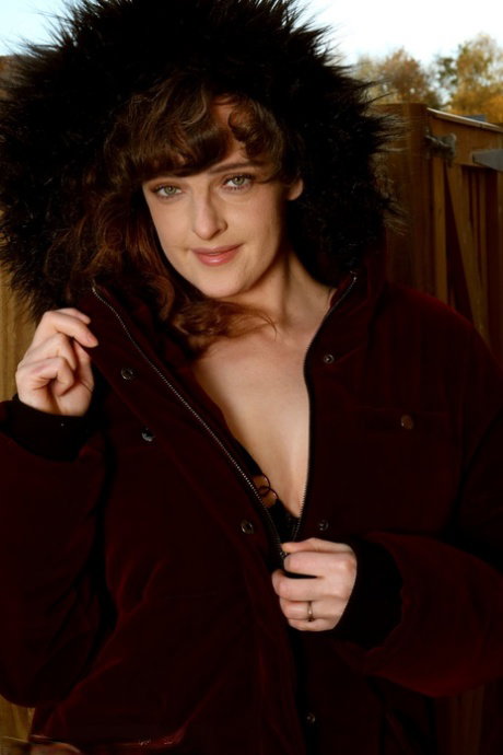 30 plus female Kate Anne strikes great solo poses in revealing lingerie