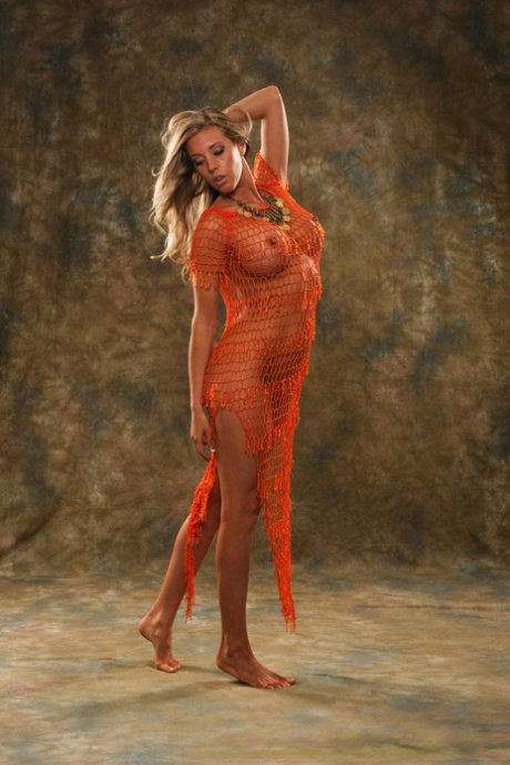 Dirty blonde female Samantha Saint takes off see thru attire to pose nude