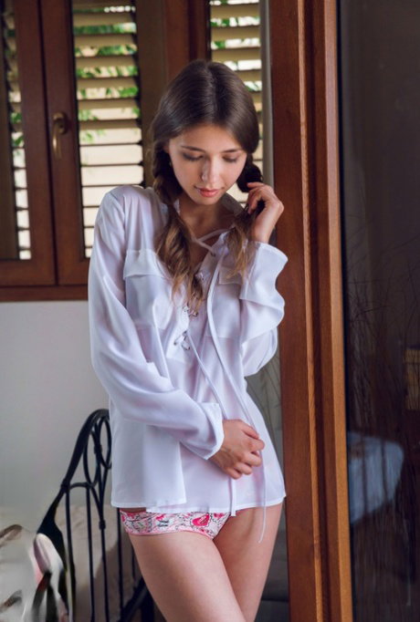 Innocent brunette teen Mila Azul strips naked with hair in pig tails