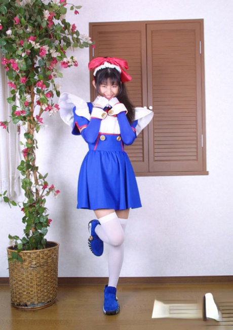 Seductive asian babe in christmass outfit uncovering her nice tits and bush