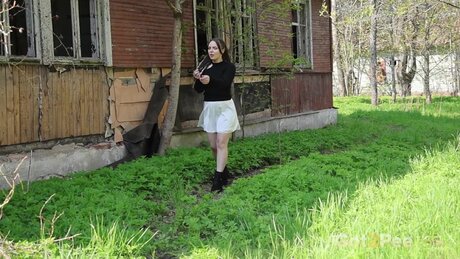 Brunette girl Violet Rilz takes a badly needed piss inside a derelict building
