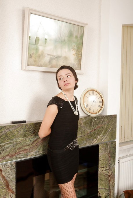Skinny babe in fishnet stockings Deiya taking off her dress and panties