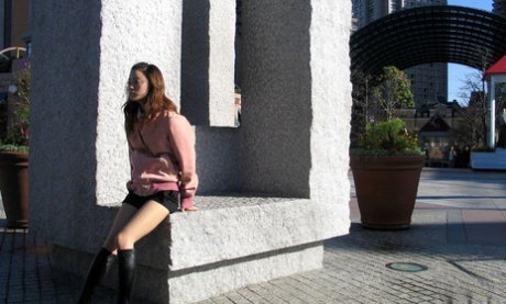 Cute Japanese teen Ayaka models in a red thong paired with black boots