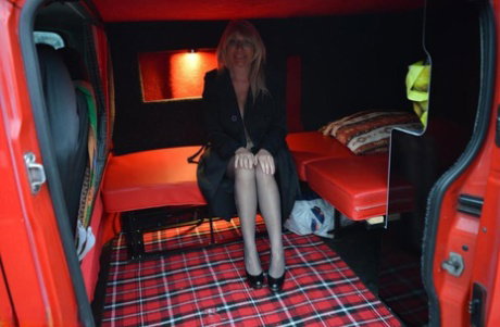 Mature blonde Barby Slut exposes herself inside a camper while in the city