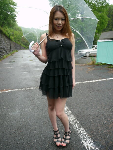 Japanese MILF Miharu Kai takes a piss on the steps before sex in the rain