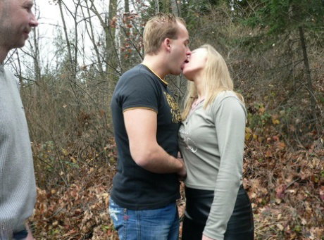 Sexy amateur MILF Moira gets facialed by two blonde guys in the forest
