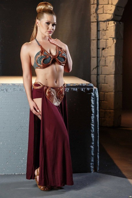 Toned blonde Abby Cross as star whores Princess Lay sheds costume to pose nude