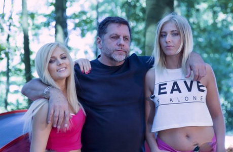 Horny Candee Licious & Aria  give middle aged man a double blowjob outdoors