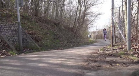 Solo girl Victoria Daniels pulls down her pants for a piss alongside a road