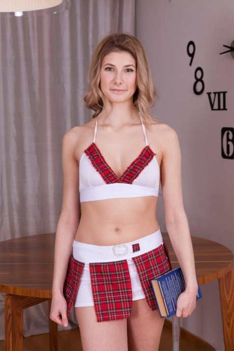 Hot Candy Bloom takes off her sexy school girl uniform and shows unshaved twat