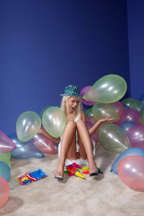 Blonde teen Rebecca Blue plays with balloons before masturbating in a hat