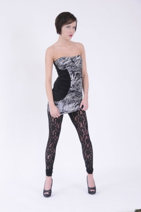 Skinny short haired vixen Kelly Klass taking her dress and black panties off