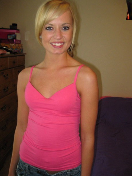 Breathtaking babe posing in her hot pink shirt and jean shorts in a solo