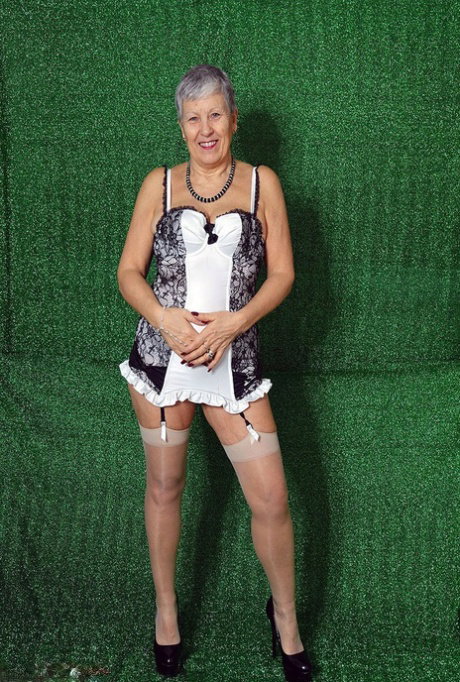 Silver haired granny Savana models sexy lingerie in sheer nylons and heels