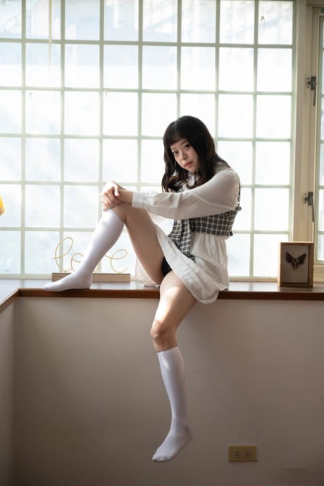 Pretty Asian babe Yuli gets fucked through her ripped pantyhose