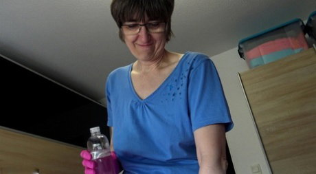 Amateur woman Hotmilf wears latex gloves while giving an oily handjob