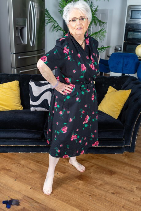 Blonde granny Caroline V undresses and masturbates using a glass dildo