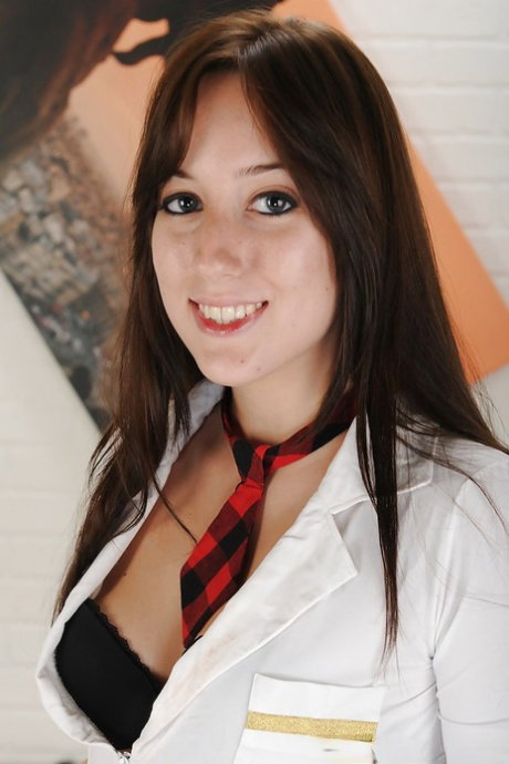 Brunette teen babe Jennifer Sloan is teasing her tiny tits
