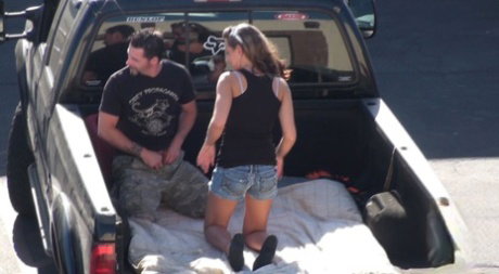 Slutty blonde Lizzy London gives public blowjob in the back pf a pickup truck