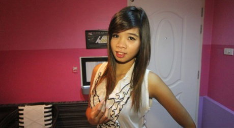 Pretty Thai teen Tuktana disrobes prior to POV sex on top of a bed
