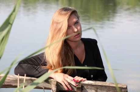 Beautiful teen Beverly A gets completely naked upon a bench on a dock
