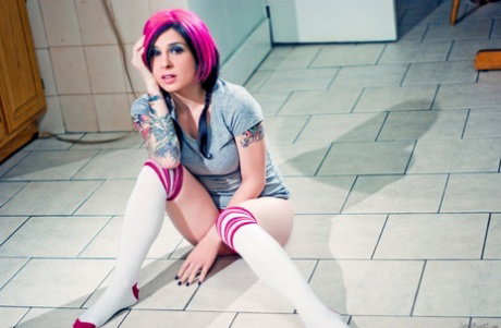 Solo model with dyed hair Joanna Angel finger spreads her bush in OTK socks