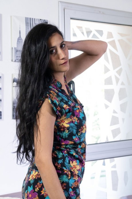 Exotic beauty Francesca strips to her high heels & plays with her hairy muff