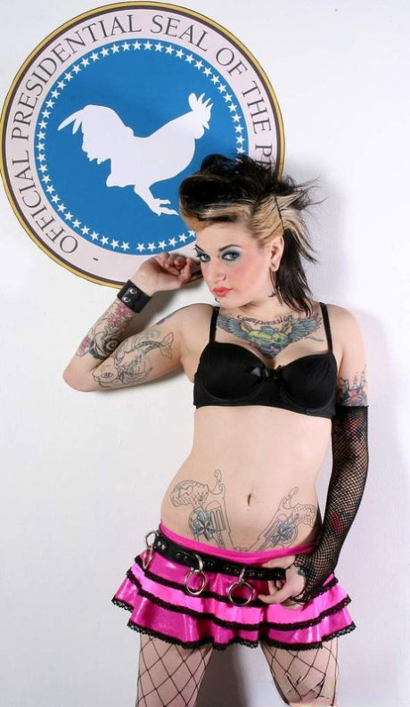 Tattooed alt model Kylee Kross shows what she has in fishnet stockings