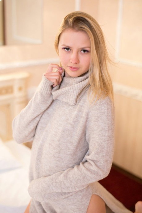 Blonde teen Jati finger spreads her tight slit after getting naked