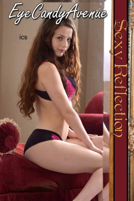 Young girl Iva Nora fondles her body while getting naked in front of a mirror