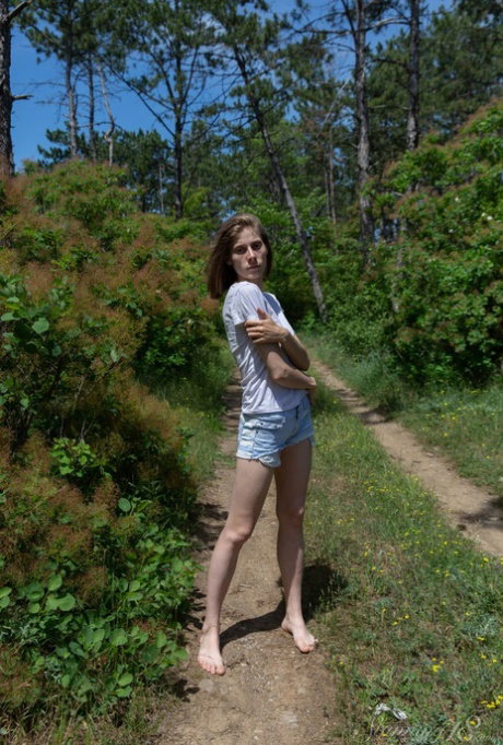 Barely legal teen Anna R gets completely naked on a dirt path in the woods