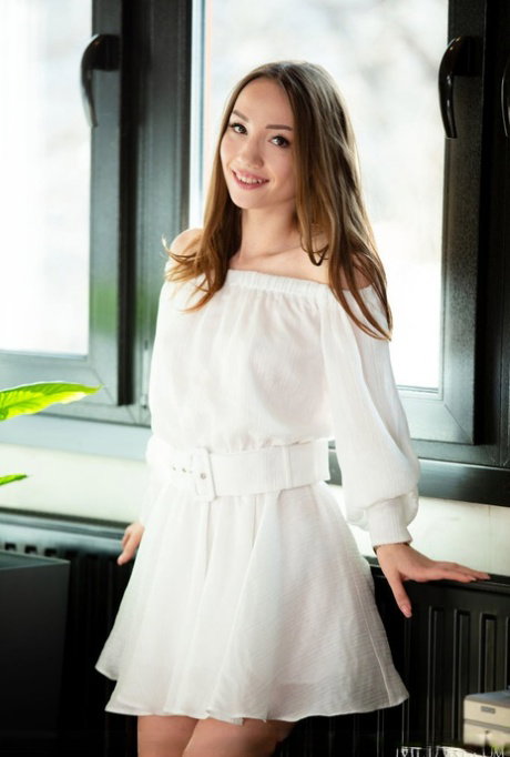 Sweet teen Kate Quinn doffs a pretty white dress to pose nude on a glass table
