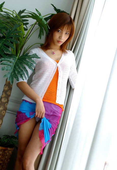 Beautiful Japanese redhead Kasumi exposes herself while changing lingerie