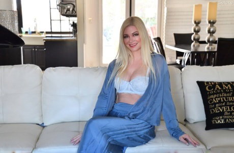 Blonde MILF Serene licks a toe after going topless in lace underwear