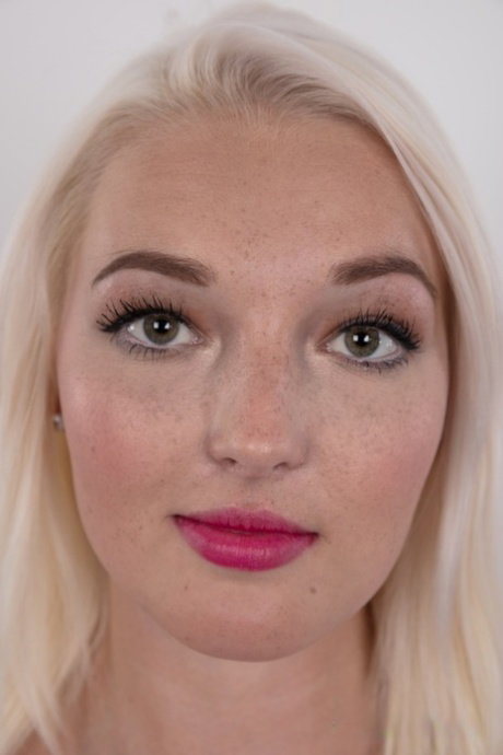 Pretty blonde Stepanka sports a touch of lipstick while getting totally naked