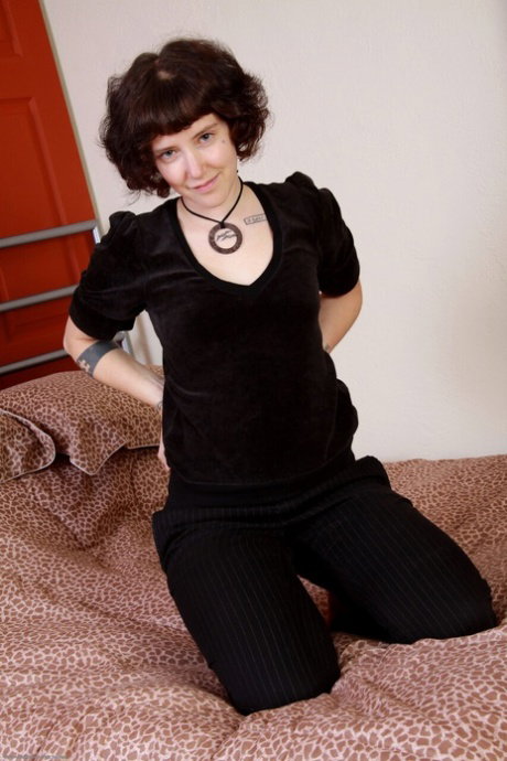 Tattooed amateur with short hair strips to a choker and red socks
