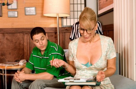 Mature tutor Erica Lauren seduces a young boy wearing glasses