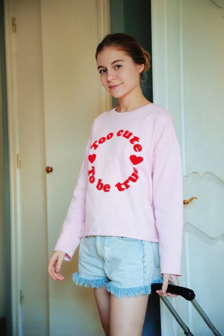 Slim teen Shayla lets her hair down while showcasing her shaved vagina