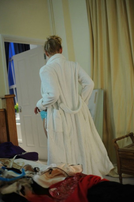 Blonde amateur Hayley Marie Coppin shows her great tits while getting dressed
