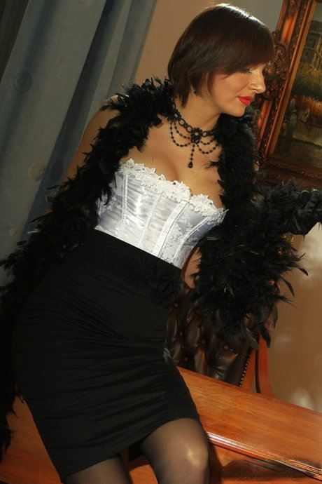 Chick in dark silk and feathers Nina Young is feeling horny at home