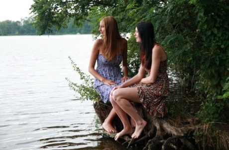 Young girls have their first lesbian kiss before a threesome in a lake