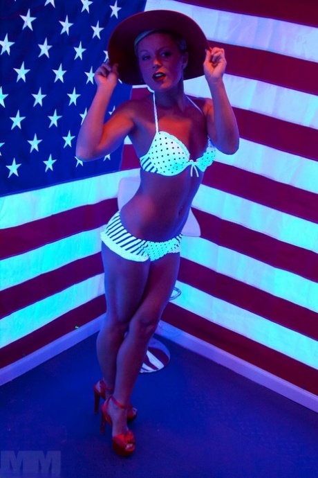 Sexy girl Meet Madden takes off her bikini top during SFW action