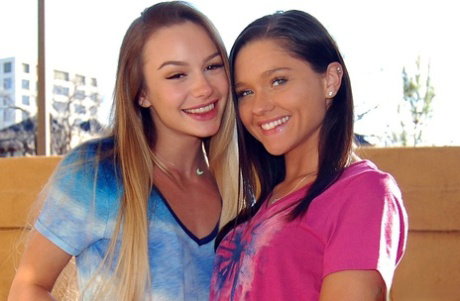 Lesbian teenage beauties Naomi and Zoe strip naked and French kiss