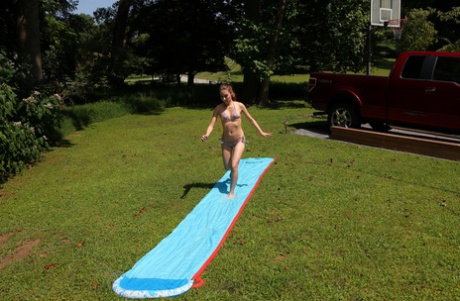 Nice teen Nicole Auclair masturbates on a pool with her bikini bottoms in her mo
