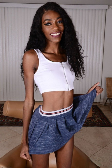 Alluring skinny ebony Chanel Skye reveals her brown muff and small tits