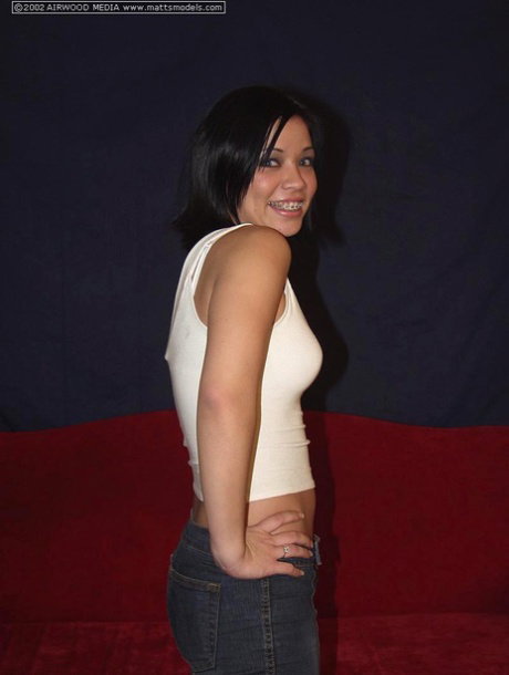 Dark haired amateur uncups her perky tits before showing her nice ass and twat