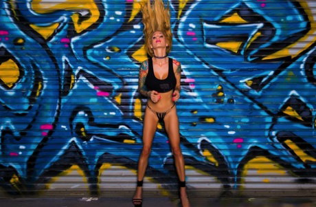 Solo girl Sarah Jessie gets naked on a table after playing with her guns