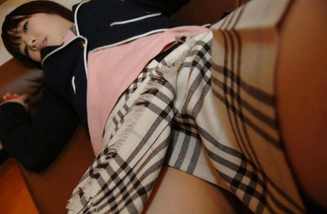 Shy asian teen undressing and exposing her juicy cunt in close up